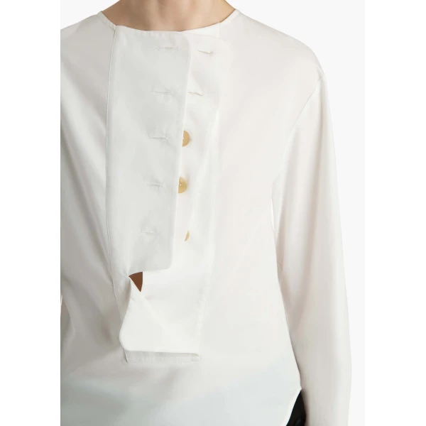 Elevate your elegance in this Khaite Tops   from the 2025 resort wear edit