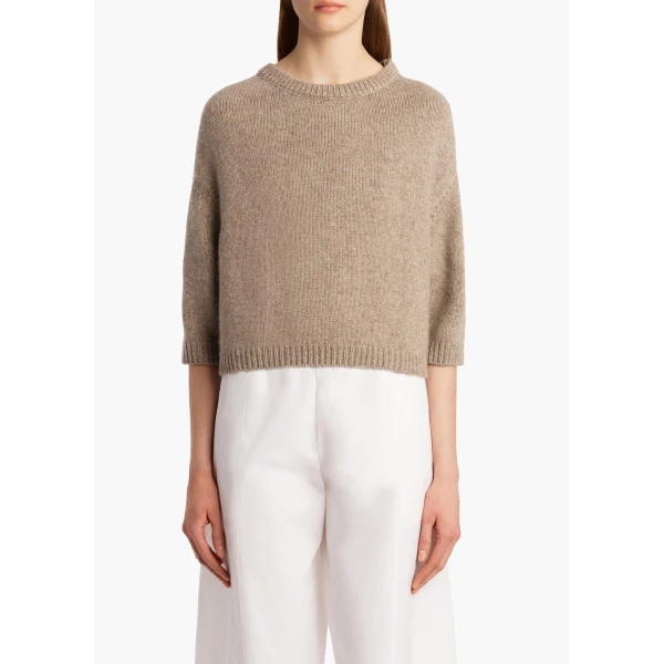 Elevate your elegance in this Khaite Knitwear   from the 2025 resort wear edit