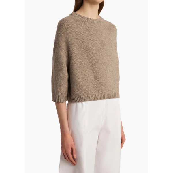 Elevate your elegance in this Khaite Knitwear   from the 2025 resort wear edit