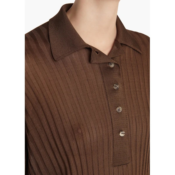 Elevate your elegance in this Khaite Tops   from the 2025 resort wear edit