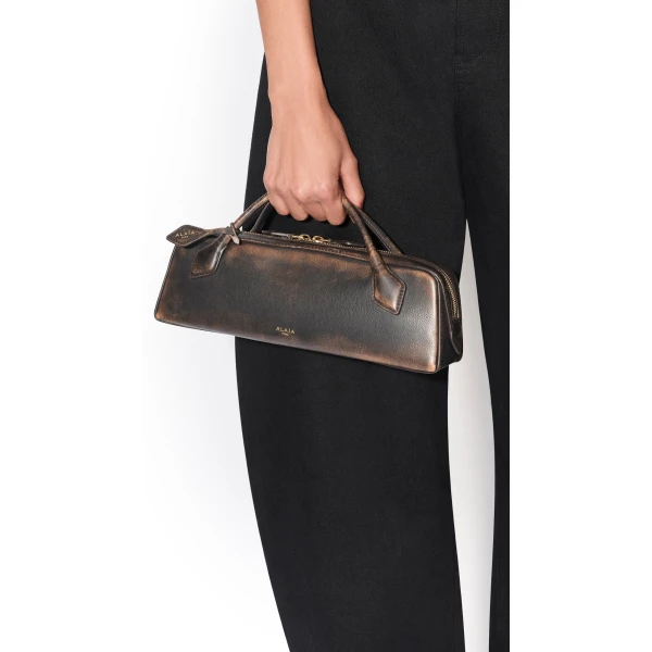 Alaïa Le Teckel Clutch In Aged Leather - Alaia Bags - Laser Cut Luxury - Shop at Luxury Shoes 