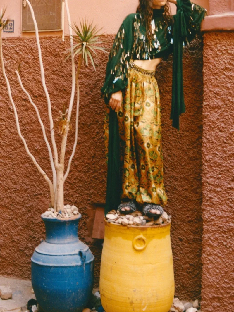 Model wearing Alemais resort 2026 collection green top