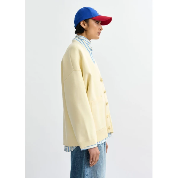 Essentiel Antwerp Off-white knit cardigan with tonal flower buttons - Essentiel Antwerp Knitwear - Colorful Belgian Design - Shop at Luxury Shoes 