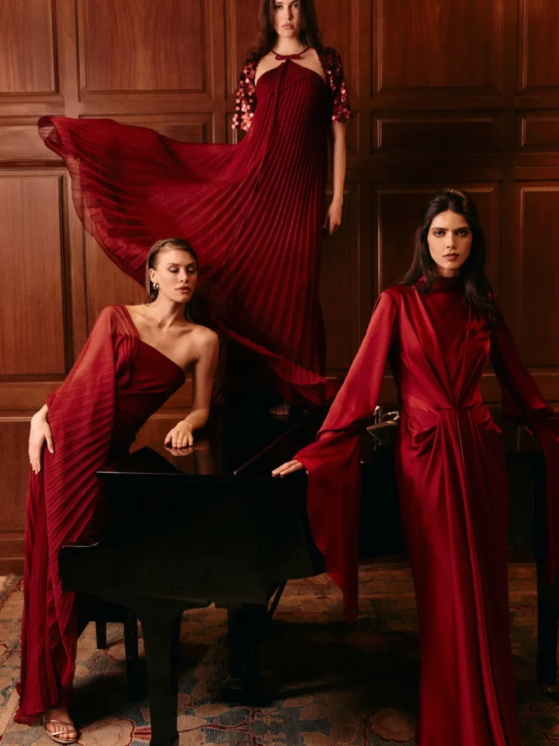 Three model wearing red gemy maalouf dresses