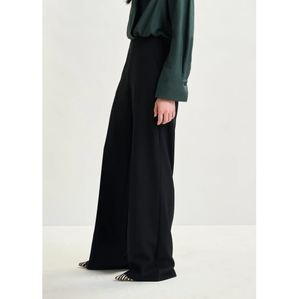 Essentiel Antwerp Black wide-leg pants with pressed crease - Essentiel Antwerp Pants - Colorful Belgian Design - Shop at Luxury Shoes 
