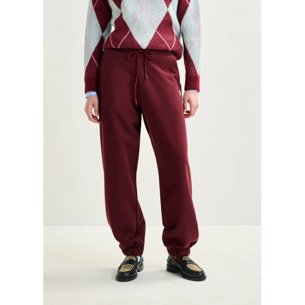 Essentiel Antwerp Burgundy cotton sweatpants with E-shaped embroidery - Essentiel Antwerp Pants - Colorful Belgian Design - Shop at Luxury Shoes 