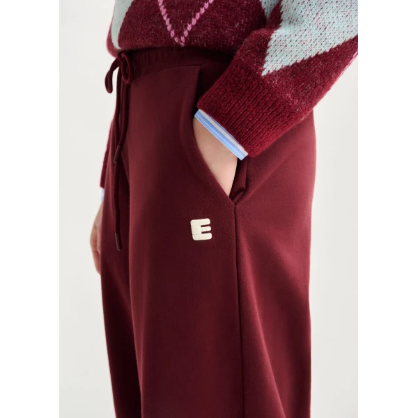 Essentiel Antwerp Burgundy cotton sweatpants with E-shaped embroidery - Essentiel Antwerp Pants - Colorful Belgian Design - Shop at Luxury Shoes 