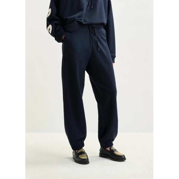 Essentiel Antwerp Navy cotton sweatpants with E-shaped embroidery - Essentiel Antwerp Pants - Colorful Belgian Design - Shop at Luxury Shoes 
