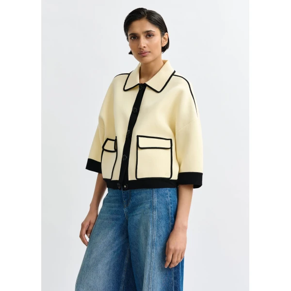 Essentiel Antwerp Off-white knit cardigan with flower buttons and black contrasting trims - Essentiel Antwerp Knitwear - Colorful Belgian Design - Shop at Luxury Shoes 