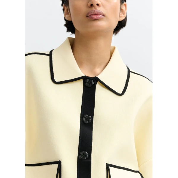 Essentiel Antwerp Off-white knit cardigan with flower buttons and black contrasting trims - Essentiel Antwerp Knitwear - Colorful Belgian Design - Shop at Luxury Shoes 