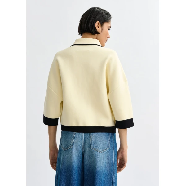 Essentiel Antwerp Off-white knit cardigan with flower buttons and black contrasting trims - Essentiel Antwerp Knitwear - Colorful Belgian Design - Shop at Luxury Shoes 