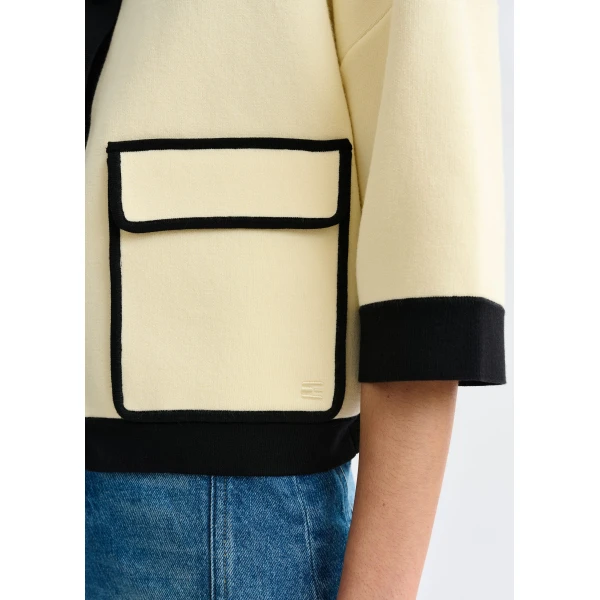 Essentiel Antwerp Off-white knit cardigan with flower buttons and black contrasting trims - Essentiel Antwerp Knitwear - Colorful Belgian Design - Shop at Luxury Shoes 