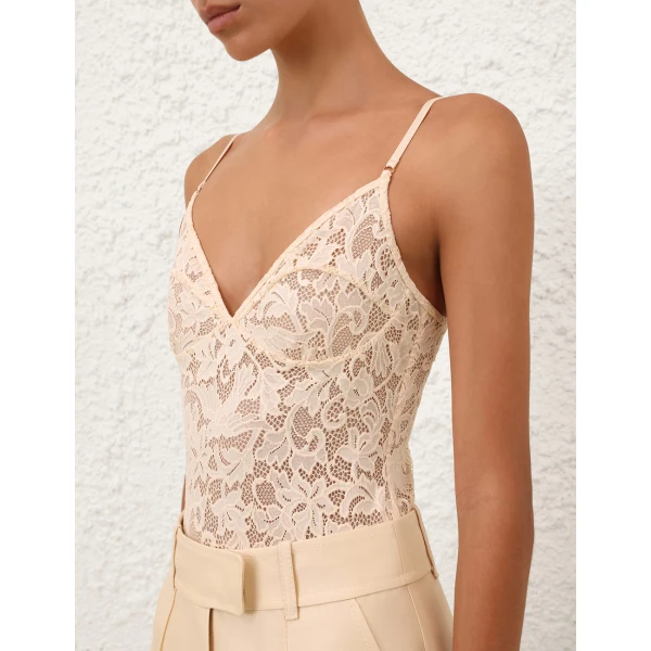 Elevate your elegance in this Zimmermann Bodysuit available now at Luxury Shoes 