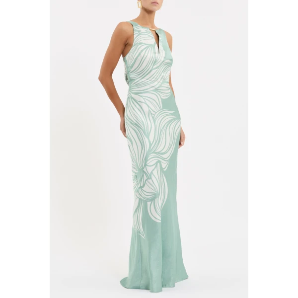 adding a subtle touch of opulence. The bias cut maxi skirt creates a graceful silhouette