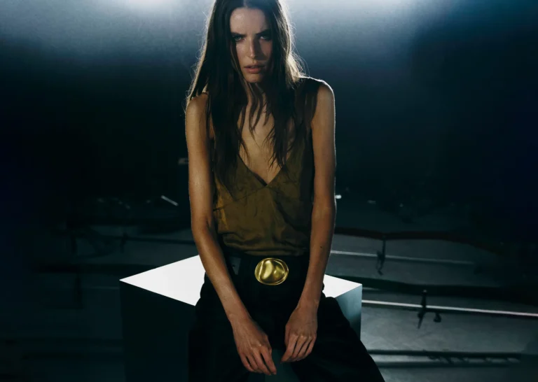 Quiet luxury outfit — camel coat, cashmere knit and tailored trousers, photographed for Luxury Shoes 
