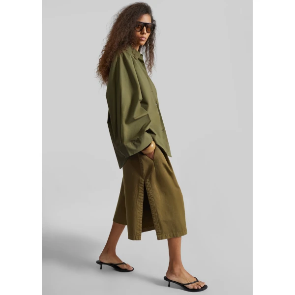 The Frankie Shop Garment Dye Pleated Culotte - Avocado - Oversized Minimalist Shorts in Green - Shop at Luxury Shoes 
