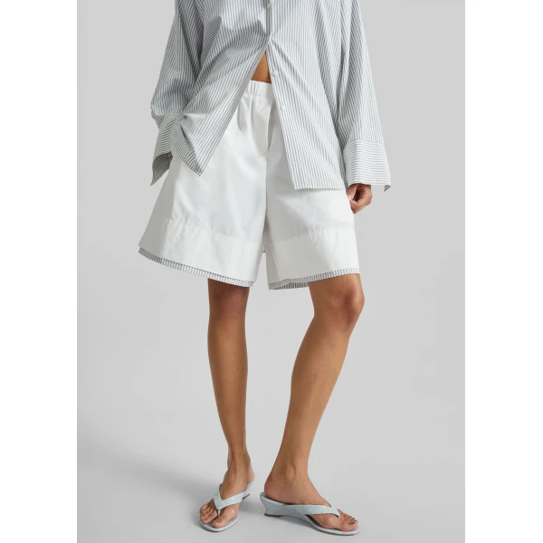 The Frankie Shop Menton Layered Hem Shorts - White/Blue Stripe - Oversized Minimalist Shorts in Multicolour - Shop at Luxury Shoes 