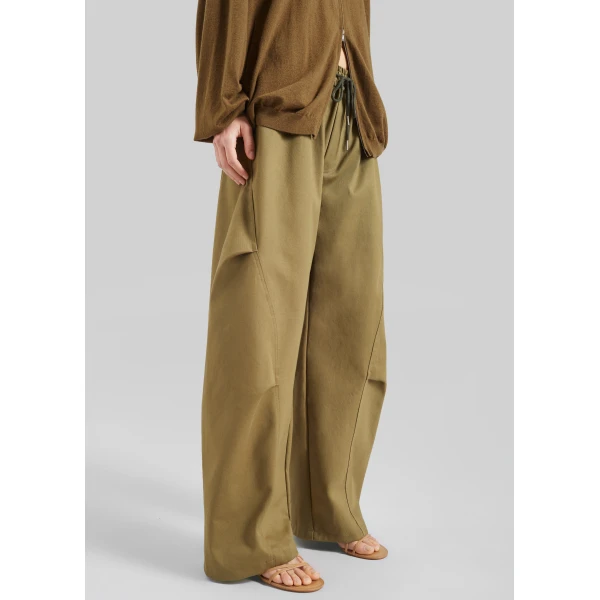 The Frankie Shop Tulsa Curved Pants - Dark Olive - Oversized Minimalist Pants in Green - Shop at Luxury Shoes 
