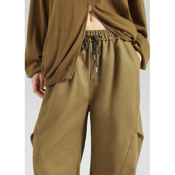 The Frankie Shop Tulsa Curved Pants - Dark Olive - Oversized Minimalist Pants in Green - Shop at Luxury Shoes 