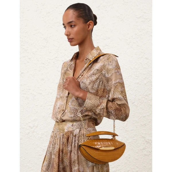 Elevate your elegance in this Zimmermann Tops available now at Luxury Shoes 
