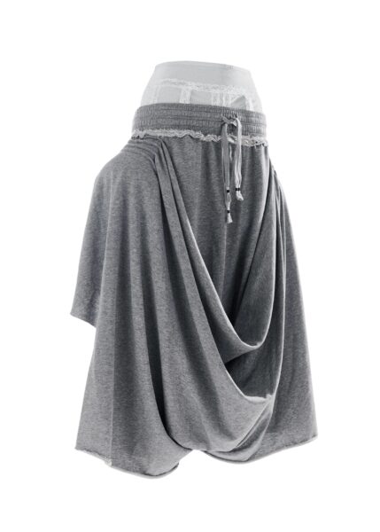 Light grey draped jersey pants with off-white lace undergarment