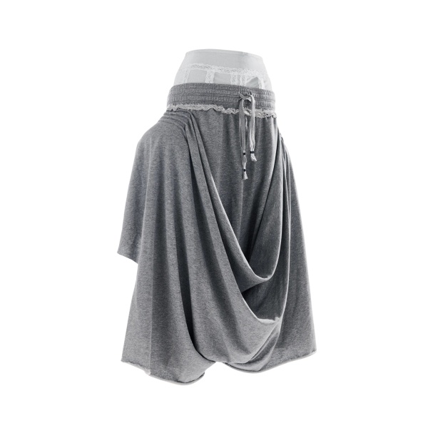 Light grey draped jersey pants with off-white lace undergarment