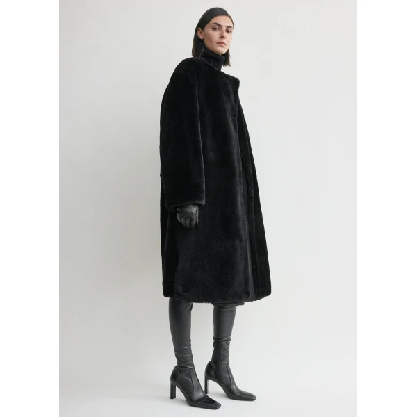 Toteme Collarless shearling coat in Black, view 3