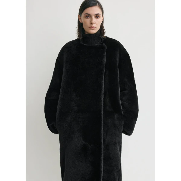 Toteme Collarless shearling coat in Black, view 5