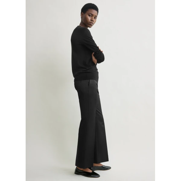 Toteme Kick flare raw-edge trousers in Black, view 4
