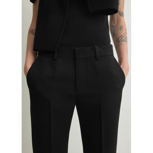 Toteme Kick flare trousers in Black, view 6