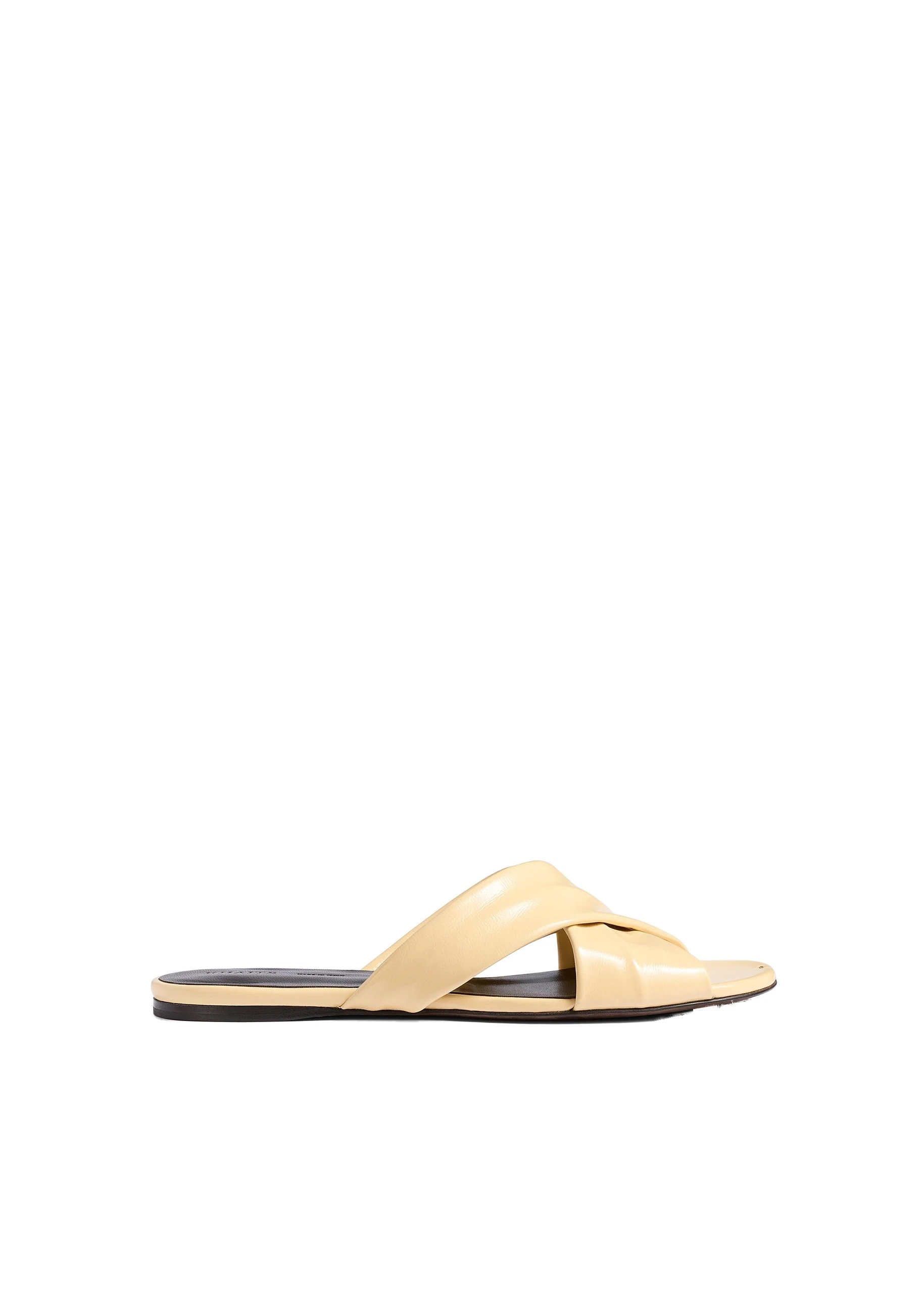 Khaite Liria Flat Sandal in Butter Glazed Leather | Buy Shoes at Luxury Shoes Khaite Liria Flat Sandal in Butter Glazed Leather