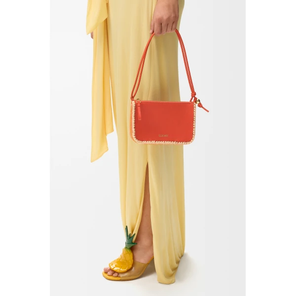 Loewe Rio pouch in classic calfskin and raffia, Deep Saffron | Clutch Bags | Luxury Shoes 