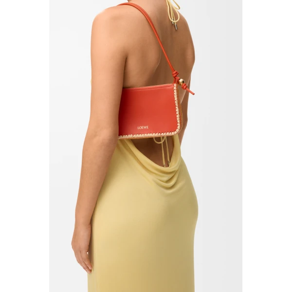 Loewe Rio pouch in classic calfskin and raffia, Deep Saffron | Clutch Bags | Luxury Shoes 