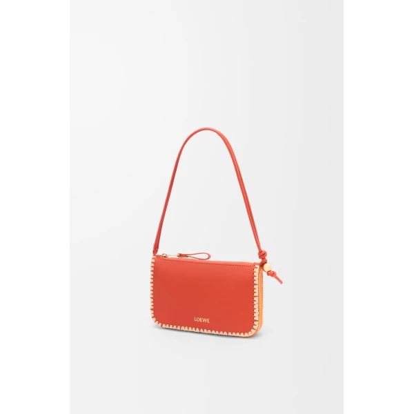 Loewe Rio pouch in classic calfskin and raffia, Deep Saffron | Clutch Bags | Luxury Shoes 