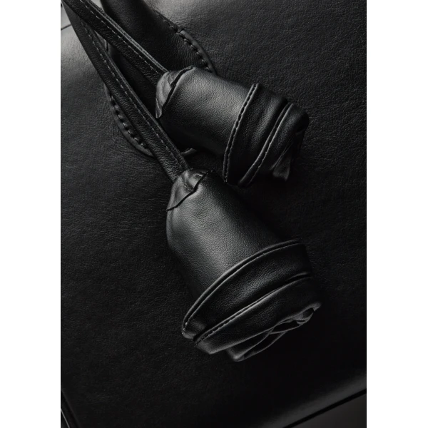Brigitte in black leather with flower charm - Image 3