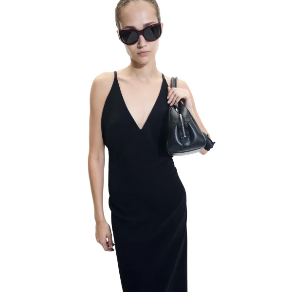 Brigitte in black leather with flower charm - Image 6