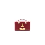 schiaparelli face clutch