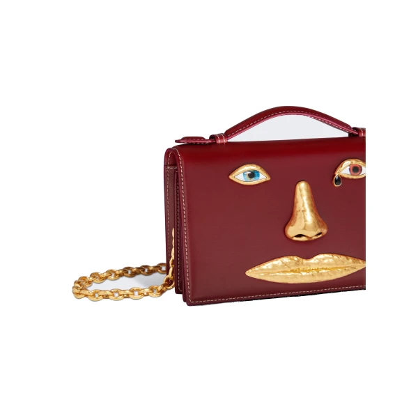 schiaparelli face clutch price