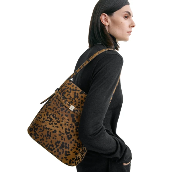Belted pony hair bucket bag in Leopard - Image 2