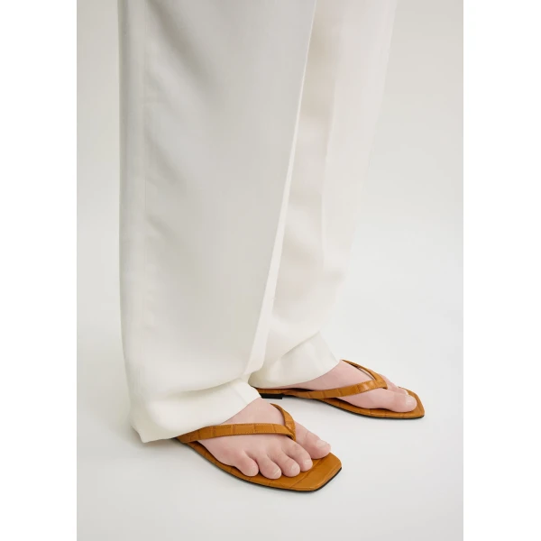 Croco-embossed flip flops in Tangerine - Image 3