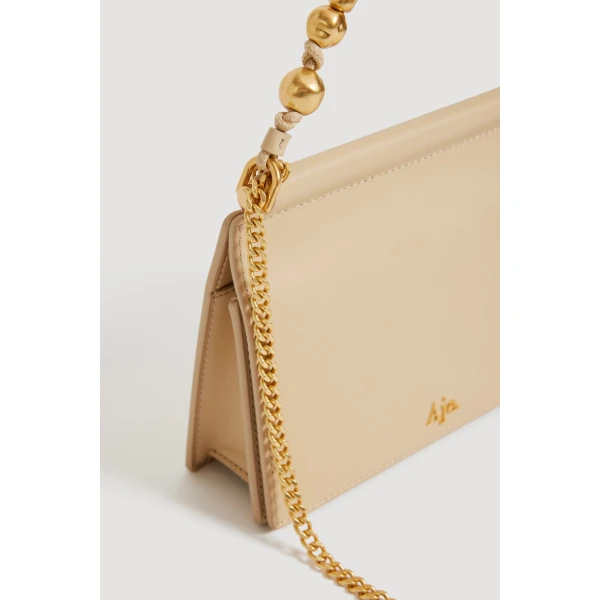 Aje Cece Clutch in Beach Beige | Clutch Bags | Luxury Shoes 