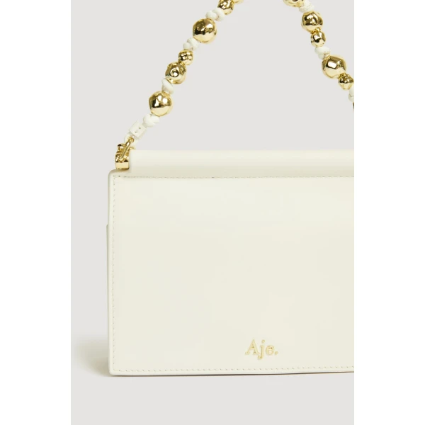 Aje Cece Clutch in Ivory | Clutch Bags | Luxury Shoes 