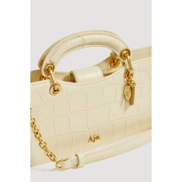 Aje Corrie Small Clutch in Ivory Croc | Clutch Bags | Luxury Shoes 