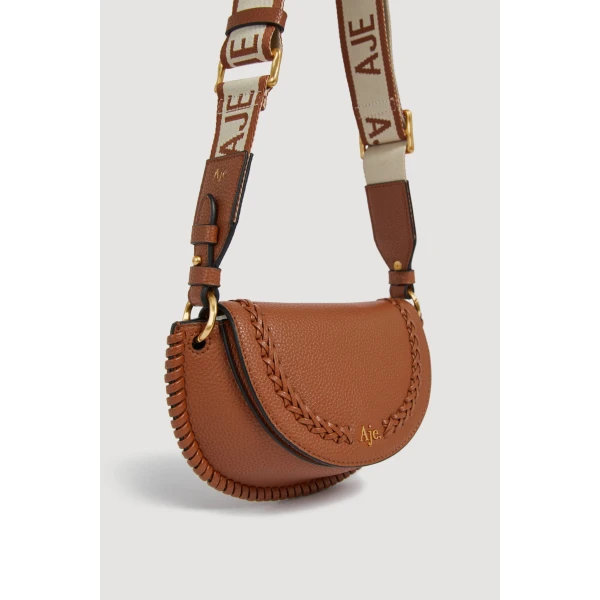 Aje Emery Small Saddle Bag in Spiced Chai | Shoulder & Crossbody Bags | Luxury Shoes 