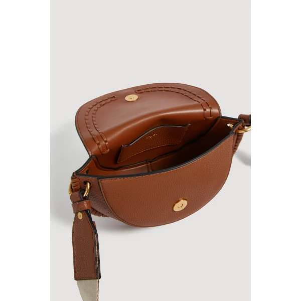 Aje Emery Small Saddle Bag in Spiced Chai | Shoulder & Crossbody Bags | Luxury Shoes 