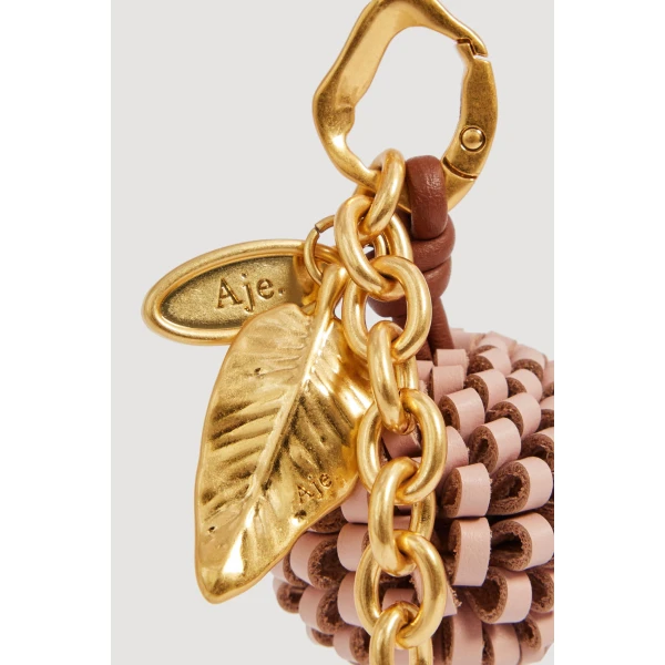 Aje Mini Pompom Charm in Fawn Pink | Bag charms | Luxury Shoes 