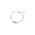 Aje Swept Logo Pearl Bracelet in Gold | Bracelets | Luxury Shoes 