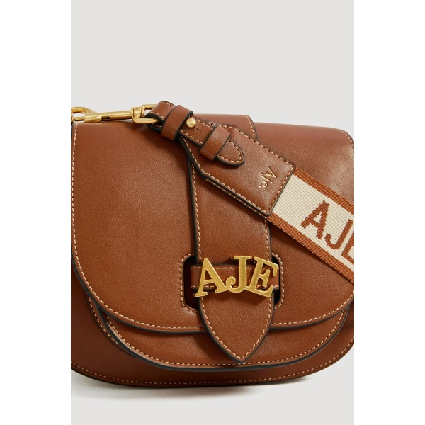 Aje Viva Small Saddle Bag in Spiced Chai | Shoulder & Crossbody Bags | Luxury Shoes 