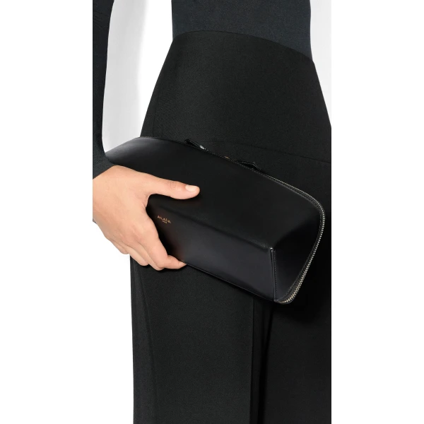 Alaia Delta Clutch in Perforated Vienne Calfskin, Black | Clutch Bags | Luxury Shoes 