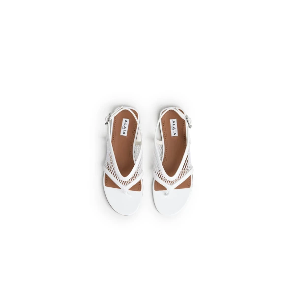 Alaia Fishnet Thong Sandals in Patent Calfskin, Optical White | Sandals | Luxury Shoes 